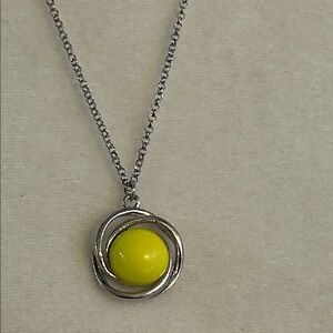 Silvertone necklace with round yellow pendant